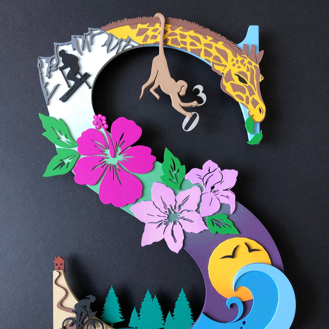 A custom gift of the initial of somebody using 'S' featuring drawn, laser cut, hand painted elements