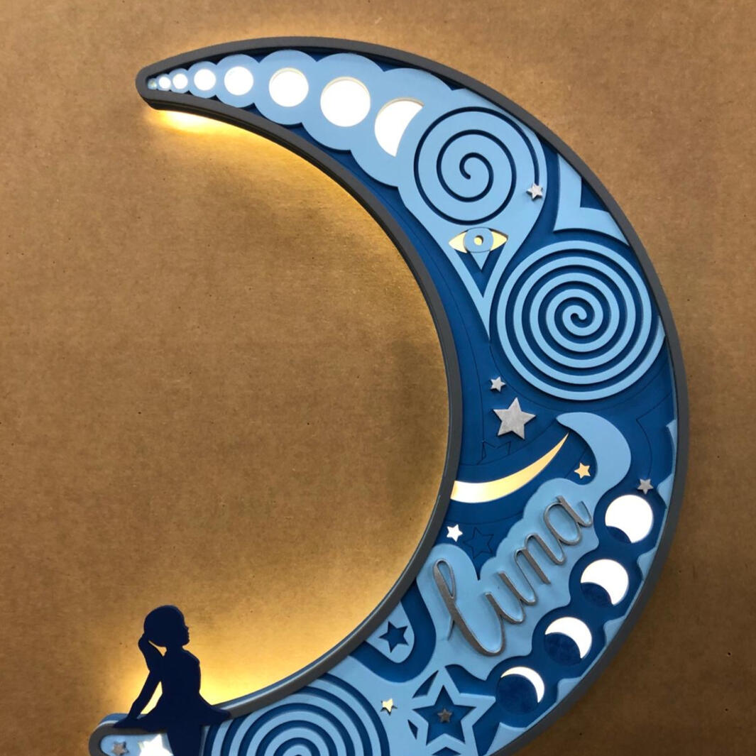 A cad drawn , laser cut and hand painted light gift